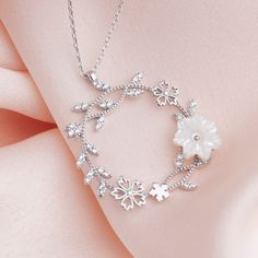 With this dainty Original 925 Silver Magnolia Necklace look as beautiful outside as you are within. This Dainty Sakura Flower Pendant is crafted with love and care for elegant moments of yours. Invest in your beauty, invest in Jewelry. These Handmade white flower necklaces are perfect for everyday wear and a perfect gift for birthdays, Christmas, or best friends. PRODUCT DETAILS The material is Solid 925 Sterling Silver. 14K Gold and rose are plated over solid 925 sterling silver. ❤ The necklace comes in a special gift box All jewelry of LeianArt is hand-made. 🎁 All Your LeianArt jewelers are nicely packaged and ready to gift in an elegant box. Ready for gift-giving. ️Please use the add gift message option if you would like to leave a gift message along with your order. 💓 100% Original 9 Sterling Silver Flower Charm Necklace, Elegant Sterling Silver Flower Necklace, White Cubic Zirconia Flower Necklace, Elegant Silver Flower Necklace With Decoration, Elegant Silver Flower Decoration Necklace, Promise Necklace, Flower Necklaces, Birthday Necklace Gift, Daisy Pendant