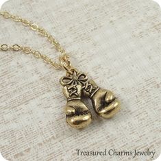 Boxing Gloves Necklace, Gold Boxing Gloves Charm on a Gold Cable Chain Brass Charm Necklace With Box Chain For Gift, Brass Charm Necklace With Box Chain As Gift, Adjustable Box Chain Charm Necklace For Gift, Gold Charm Necklaces With Box Chain For Gifts, Gold Charm Necklace With Box Chain For Gifts, Gold Charm Necklace With Box Chain As Gift, Sports Packaging, Gold Boxing Gloves, Dog Bones