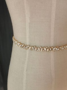 Color: rose gold\gold\silver width is 1.5 cm Crystal straps, wedding dress, Beaded shoulders, beaded belt, beaded straps, bridal accessories, Bridal Epaulettes, dress straps, Crystal straps, wedding dress, Beaded shoulders, beaded belt, beaded straps, bridal accessories, Bridal Epaulettes, Wedding dress straps, Bridal straps, dress straps, shoulder straps, bridal bling, dress straps ABBIE Diamante and pearl straps for a bride or your special occasion dress. Limited ready to sew on/in seam straps Elegant Gold Fitted Bridal Belt, Elegant Gold Bridal Belt, Elegant Fitted Gold Bridal Belt, Elegant Gold Bridal Belt For Bride, Elegant Bling Bridal Belt For Wedding, Gold Crystal Bridal Belt For Party, Gold Crystal Bridal Belt For Wedding, Elegant Gold Bridal Belt With Rhinestones, Fitted Gold Sash For Wedding