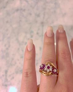 Metal: 14K Yellow And White Gold Stone: Diamond And Ruby Shape: Round Approximate Diamond Total Weight: .32 Carats Approximate Ruby Weight: .61 Carats Ring Size: 6 Sizable: Yes. Please state size in size/personalization box if needed. Weight of entire piece with stones: 4.70 grams Measurements of Top Part Of Ring: 13 mm Long Circumference Of Flower: 7 mm and 8 mm Shank Tappers Down To: 2 mm Original Listed Price: $825 Matching Earrings: https://www.etsy.com/listing/508483667/14k-ruby-and-diamond Purple Ruby Ring With Diamond For Anniversary, Anniversary Ruby Ring With Diamond Accents, Heirloom Style Brilliant Cut Ruby Ring, 14k Stamped Ruby Ring, Yellow Gold Multi-stone Cluster Ring, Gold Cluster Ruby Ring For Anniversary, Anniversary Multi-stone Diamond Ring, Yellow Gold Ruby Ring For Anniversary, Diamond And Ruby Ring