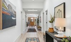 the hallway is clean and ready for us to use as an entrance way in this home