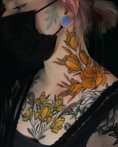 a woman with tattoos on her neck and nose