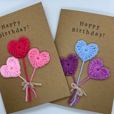 two birthday cards with crocheted hearts on them