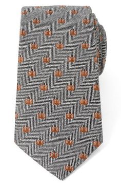 Small, bright pumpkins neatly punctuate a tie made with silk and linen in a herringbone weave that smartens any holiday look. 3" width; 59" length 50% silk, 30% cotton, 20% linen Dry clean Imported Elegant Fall Standard Tie, Elegant Fall Workwear Ties, Formal Fall Standard Tie Accessories, Formal Fall Standard Tie Suit Accessories, Formal Fall Suit And Tie Accessories Standard Tie, Classic Fall Ties For Formal Occasions, Classic Ties For Formal Occasions In Fall, Classic Formal Ties For Fall, Classic Fall Formal Ties