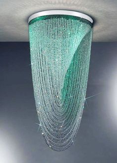 a green chandelier hanging from the ceiling