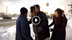 three people standing in the snow talking to each other and one person holding his hand