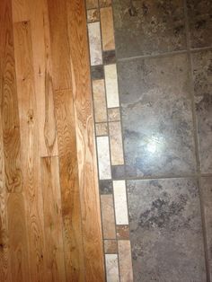 a bathroom with wood floors and tile on the floor