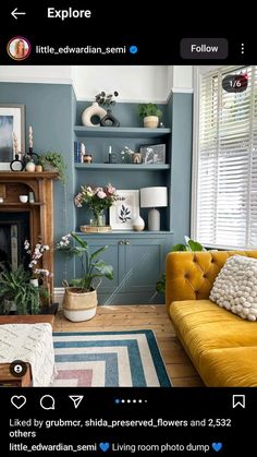 a living room filled with furniture and a fire place