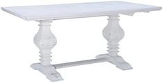 a white table with an ornate design on the top and base, against a white background