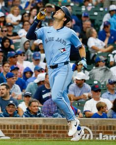 a baseball player is running on the field