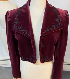 This is the last jacket we have in this style, size or color. Photos lightened to augment details. Gallery photo best illustrates true color. EXCELLENT VINTAGE CONDITION, DRY CLEANED Downtown Jacket (No. 534017). The downtown, insouciant state of mind. Creates a cheerful stir. Soutache braid vining down the lapels, around the front and at the cuffs. Sleeves and hem are slightly rounded. Can't feel bad in this. Can't look bad, either. Cotton velvet with a lovely sheen, 100% acetate satin lining. - J Peterman Owner's Manual Original retail price: $198. Color: Burgundy Wine. Circa 1995. Original retail price: $198. Color: Burgundy Wine. Circa 1995. Marked a size 4, it measures: bust 34-35, waist to 32, shoulder to shoulder 15, sleeve length from shoulder 24, center back seam length 18. Boxed Downtown Jacket, J Peterman, Vintage Vest, Burgundy Wine, Velvet Jacket, Gallery Photo, Embroidered Jacket, Cotton Velvet, Crop Jacket