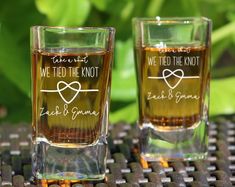 two shot glasses with the words we tied the knot and thank you're grandma