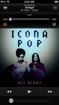 two people standing next to each other in front of a neon sign that says icona pop