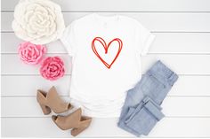 Cute Valentines Day Tee for women These adorable valentines day tshirts are available in Multiple Colors. This sweet shirt with a modern doodle heart design is made from the softest material in high quality print making it perfect to layer this Valentines Day. Pair this comfy t-shirt with your favorite jeans or leggings and jacket for and adorable V-day outfit ! Handmade with Love...Great for valentines day outfits and casual wear for the rest of the year !! Sizes: XSmall (0-4) Small (4-6) Mediu Trendy Cotton T-shirt For Valentine's Day, Trendy Heart Print T-shirt For Spring, Trendy Heart-shaped T-shirt For Spring, Trendy Relaxed Fit T-shirt With Heart Print, Casual Cotton T-shirt For Valentine's Day, Trendy Cotton T-shirt With Heart Print, Casual Valentine's Day T-shirt With Heart Graphic, Trendy Valentine's Day Graphic Print Tops, Valentine's Day Trendy Graphic Print Tops