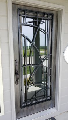 a door with a decorative iron design on the front and side glass, is shown