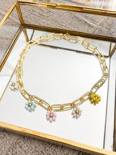 "The Florence necklace is a statement piece!  Handcrafted with our 24k gold filled large paperclip chain and seed bead daisy charms! 17\" L. Clasp closure." Seed Bead Daisy, Bead Daisy, Flower Charm Necklace, Daisy Charm, Color Flower, Flower Charm, Paper Clip, Seed Bead, Statement Pieces