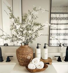 a basket with flowers in it sitting on a bathroom counter