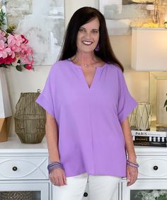 Introducing our "On Cloud Nine Top" in Lavender, a dreamy and stylish addition to your wardrobe that's perfect for adding a touch of elegance to any outfit. This woven bubble airflow split neck top offers a chic and sophisticated look with a relaxed fit that's both comfortable and flattering.
Crafted with care, this top features a split neck design that adds a modern twist to the classic silhouette. The soft lavender color evokes a sense of tranquility and serenity, making it perfect for both casual and dressy occasions.
Available in sizes S to L, this top is designed to fit a variety of body types, ensuring a comfortable and flattering fit for everyone. Whether you're heading to the office, meeting friends for brunch, or enjoying a night out on the town, this top is sure to become a stapl Versatile V-neck Top For Spring Day Out, Feminine Spring Tops With Split Neck, Chic Split Neck Top For Day Out, Feminine Split Neck Tops For Spring, Elegant Split Neck V-neck Top For Spring, Versatile Purple Top For Spring, Chic Flowy Blouse With Split Neck, Chic Flowy Split Neck Blouse, Versatile V-neck Top For Spring