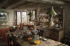 a dining room table with plates and cups on it