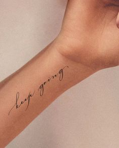 a woman's arm with a tattoo that says, i am going on it