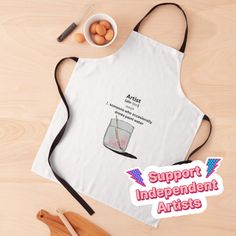 an apron with the words support independent artists on it next to eggs and utensils