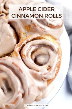 apple cider cinnamon rolls on a white plate with text overlay that reads, apple cider cinnamon rolls