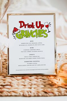 a drink up grinches menu sitting on top of a table