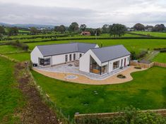 an aerial view of a house in the countryside