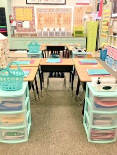 an empty classroom with lots of desks and plastic bins on the top tables