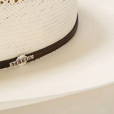 The Lobo 10X Straw Cowboy Hat is constructed of 10X quality straw and features an all-around ventilated cattleman crown and leather hatband with silver and gold toned accents. 10X Quality Straw. Made in USA. Brim: 4 1/4" Crown: 4 1/8" Regular Oval 10X Collection Vintage Fashion 1950s, Mad Hatter Hats, Straw Cowboy Hat, Kentucky Derby Hats, Fashion 1950s, Christian Dior Couture, Thigh Boot, Western Hats, Cloche Hat