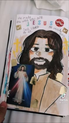 someone is holding up a book with an image of jesus on it and the words jesus written in different languages