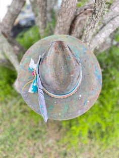 Mad Hatter multi color paint flat brim fedora hat  -hand burned burnt and distressed - Alexis Wisniewski-inspired hat Sz M Personalization can be requested for an additional cost.  Personalization can include, but is not limited to, added art,  added burned designs, changing hat band colors and/or elements  can be added (i.e., rhinestone, lace,  turquoise, feather, playing card, burnt playing card, etc.). ** There may be a variation in materials used due to each hat being uniquely designed and h Burned Hats, Colorful Hat, Stetson Hat, Painted Hats, Pink Jewels, Hat Design, Color Paint, Cowgirl Hats, Felt Hat