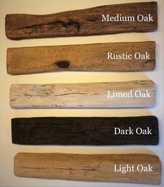 four different types of wood used in the making of wooden planks are displayed on a white wall