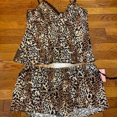 A Sexy Leopard Print Studio Donatella 2 Piece Cami & Shorts Pj Set In Xl. Brown And Black Leopard-Print With Black Lace Along Cami Chest. Adjustable Straps On Cami. You Will Electrify! 92% Polyester, 8% Spandex. Machine Washable. New With Tags. Fitted Leopard Print Sleepwear For Loungewear, Short Pj Set, Print Studio, Black Leopard, Pj Sets, Black Tan, Women's Intimates, Black Lace, 2 Piece