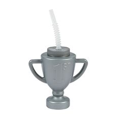 a silver cup sitting on top of a metal stand with a toothbrush in it