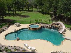 an aerial view of a swimming pool and slide