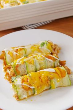 zucchini enchiladas on a white plate with the title overlay