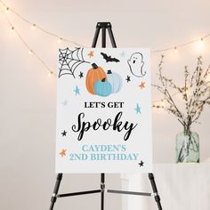 a sign that says let's get spooky, cayens and birthday