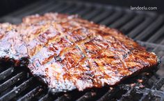 a steak is cooking on the grill outside