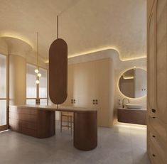 a modern bathroom with large round mirrors and lights on the ceiling, along with an oval sink