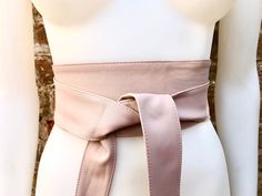 Dusty  pink OBI BELT in natural soft genuine leather. WIDER MODEL wrap belt.  Genuine leather pink waist belt.  The belt is 208 cm (81 inch) long and 8 cm (3 inch) at its widest (front) it gets smaller towards the end up to 3 cm (1 1/4 inch).  This model is wider  and slightly different, the "strap" passes through a slite of the belt.  Adequate for a size s, m or L with a narrowish waist, otherwise please take a look at our other belts that come in regular and longer sizes.  Our suede and genuin Chic Belted Corset Belt For Spring, Chic Spring Corset Belt With Removable Feature, Chic Spring Corset Belt With Removable Belt, Adjustable Chic Corset Belt For Spring, Chic Adjustable Corset Belt For Spring, Summer Chic Corset Belt With Removable Belt, Chic Belts For Spring Night Out, Adjustable Corset Belt For Spring, Chic Belts For Night Out In Spring