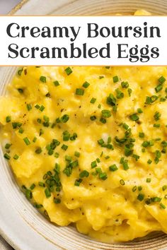 creamy boursin scrambled eggs with chives in a white bowl