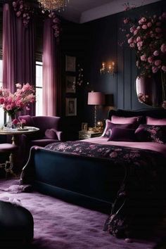 a bedroom decorated in purple and black with pink flowers on the bed, chandelier