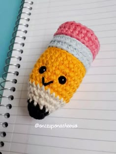 a crocheted pencil holder with an ice cream cone in the shape of a face