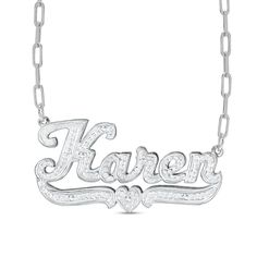 Make your style known with this personalized diamond name necklace. Sterling silver Features your name, three to 10 characters in length, sculpted in a cursive script font A scrolling heart-centered underline shines below Hammered finish 1/15 ct. t.w. of diamonds 18.0-inch paperclip chain necklace; lobster claw clasp Engraved White Gold Nameplate Necklace, Engraved White Gold Name Necklace For Anniversary, Signature Silver Jewelry With Names, Personalized Silver Diamond Name Necklace, Silver Name Necklace With Diamond Accents For Anniversary, Anniversary White Gold Name Necklace With Diamond Accents, Anniversary White Gold Name Necklace With Diamonds, Personalized Diamond Name Necklace In White, Personalized Diamond Name Necklace In Silver