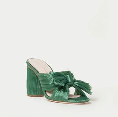 Upgrade your wardrobe with the Sage Penny Pleated Bow Heel by Loeffler Randall. This designer heel features a stunning green hue with a sophisticated pleated design, open toe, and chunky heel. Discover why this chic sandal is taking the fashion world by storm and why you need it in your shoe collection. Bow Fabric, Bow Mules, Wedding Shoes Low Heel, Trending Sandals, Bridal Heels, Faux Leather Heels, Bow Heels, Beautiful Gift Wrapping, Pleated Fabric