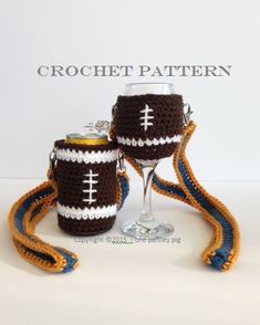 two crocheted wine glasses are sitting next to each other