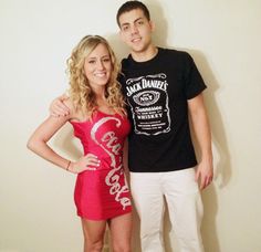 a man standing next to a woman in a short red dress and black t - shirt