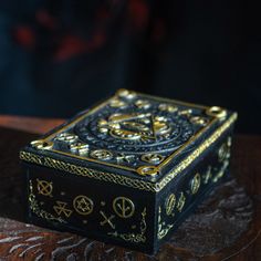 a black and gold box sitting on top of a table