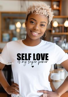 Introducing our Short Sleeve T-Shirt: "Self Love Is My Super Power." Elevate your wardrobe with this empowering statement piece that embodies confidence and self-affirmation. Crafted with premium materials for comfort and durability, this t-shirt is perfect for everyday wear. Whether you're hitting the gym, running errands, or simply lounging at home, let the world know that self-love reigns supreme. Embrace your inner strength and radiate positivity with our "Self Love Is My Super Power" t-shirt. Available in a variety of sizes and colors to suit your unique style. Order now and unleash your superpower! Self Love Tshirts, Radiate Positivity, Pride Tees, Cute Office, Black Culture, Inner Strength, Cute Tshirts, The Gym, Super Powers